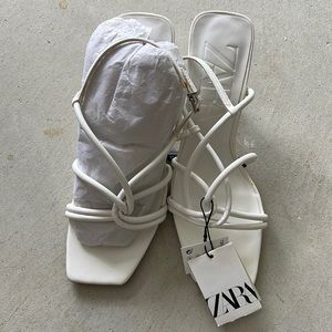 White Zara strap sandals with small heel.
